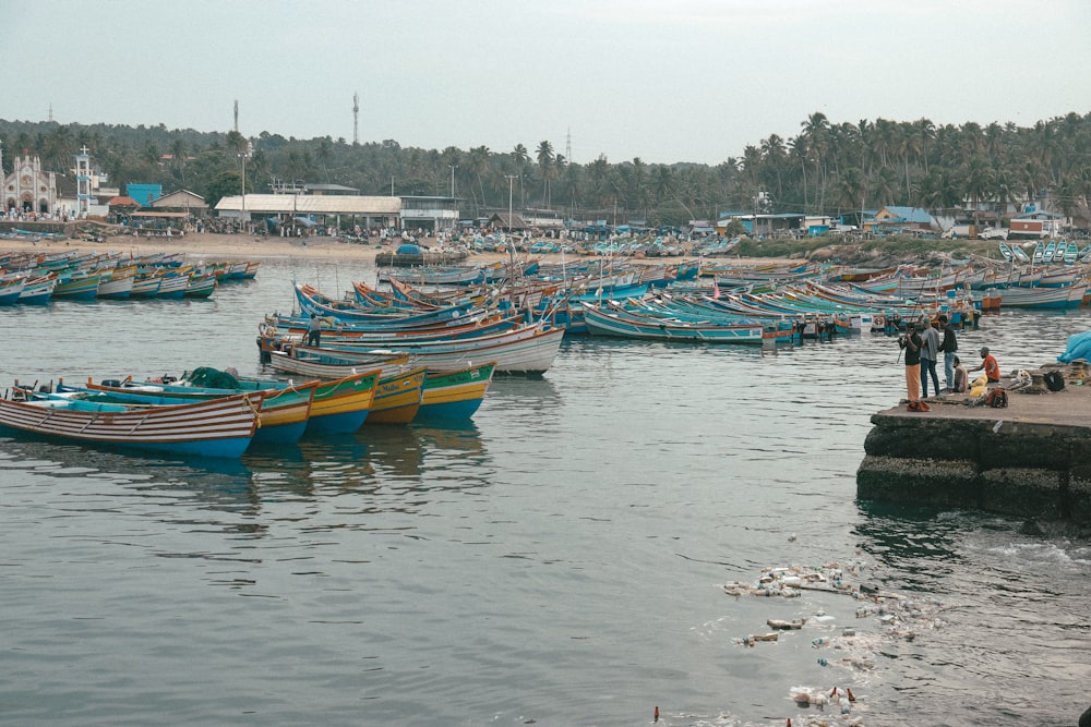 a group of boats that are sitting in the water