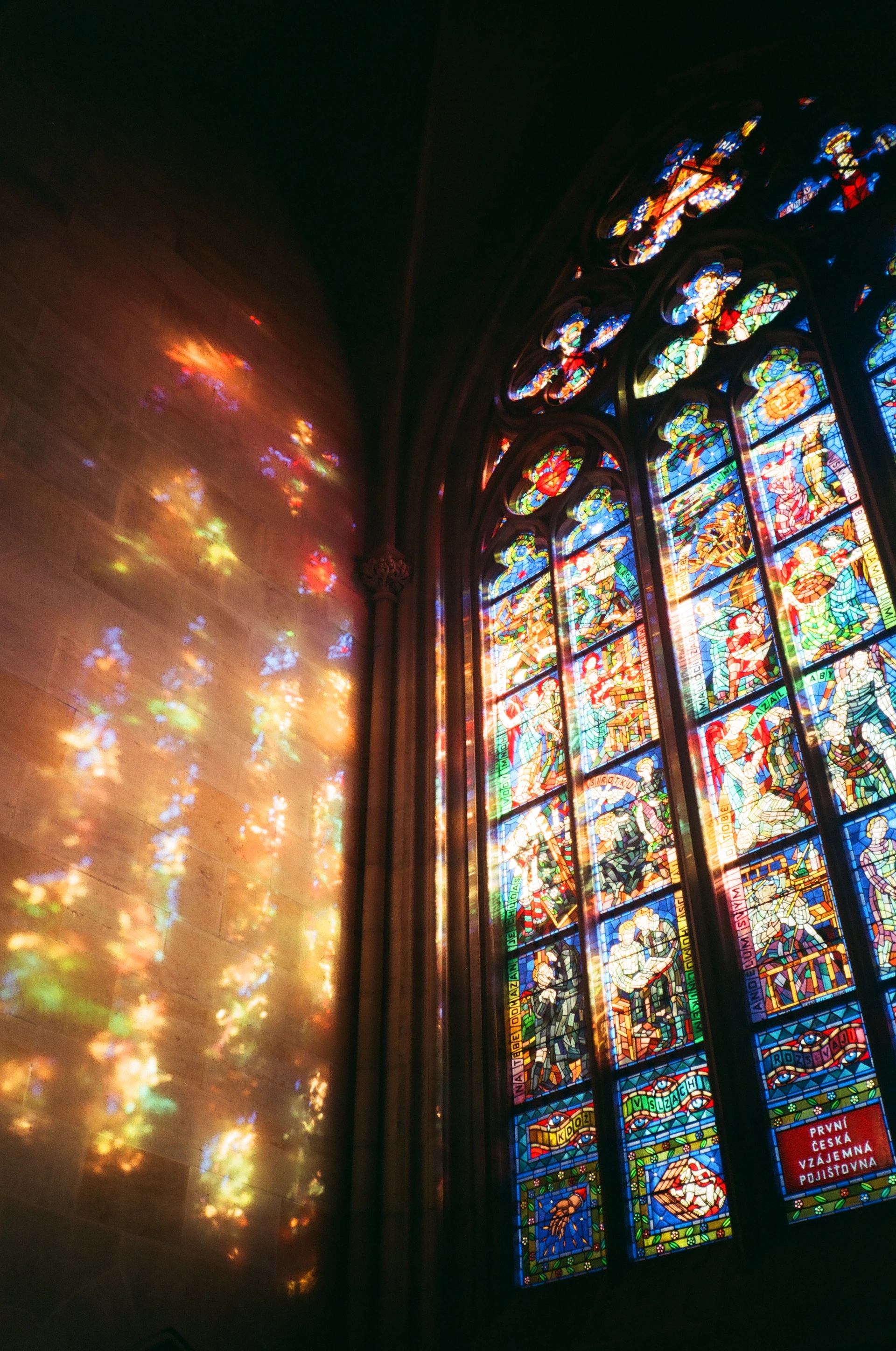 a large stained glass window in a church