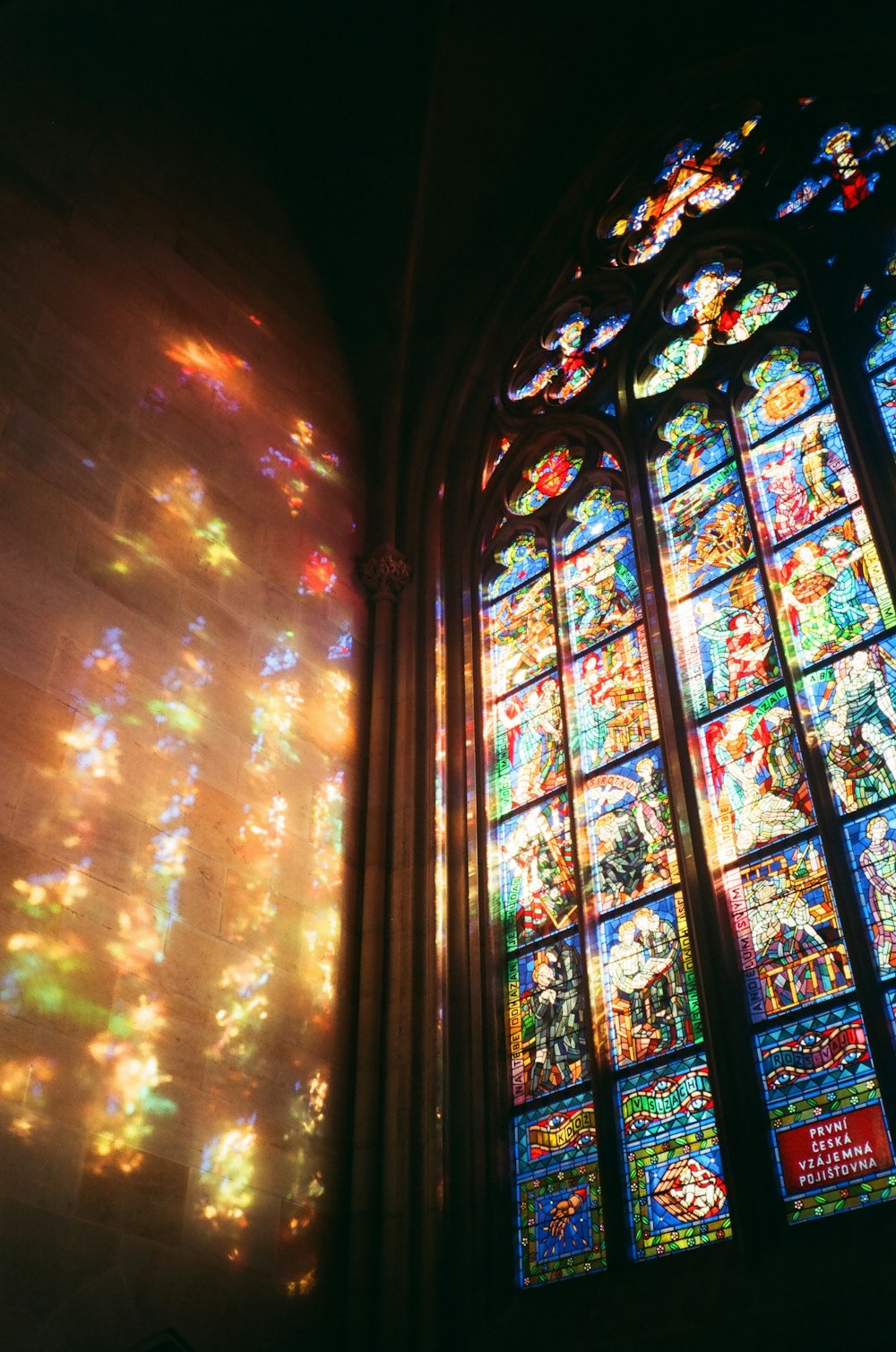 a large stained glass window in a church