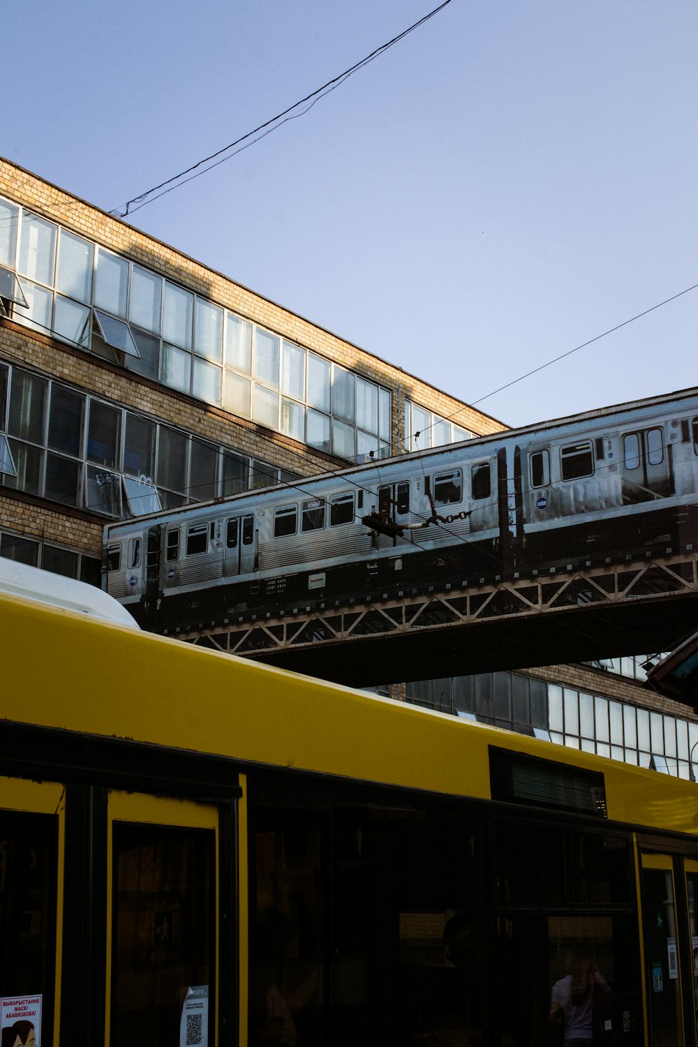 a train is going over a bridge in a city