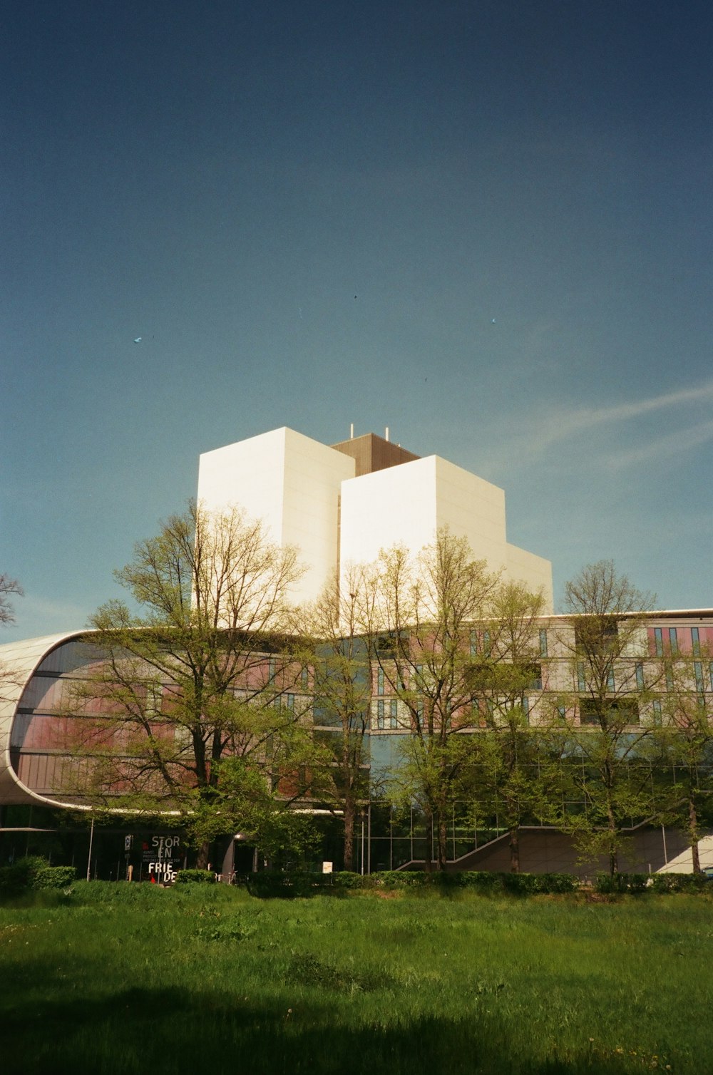 a large building with trees in front of it