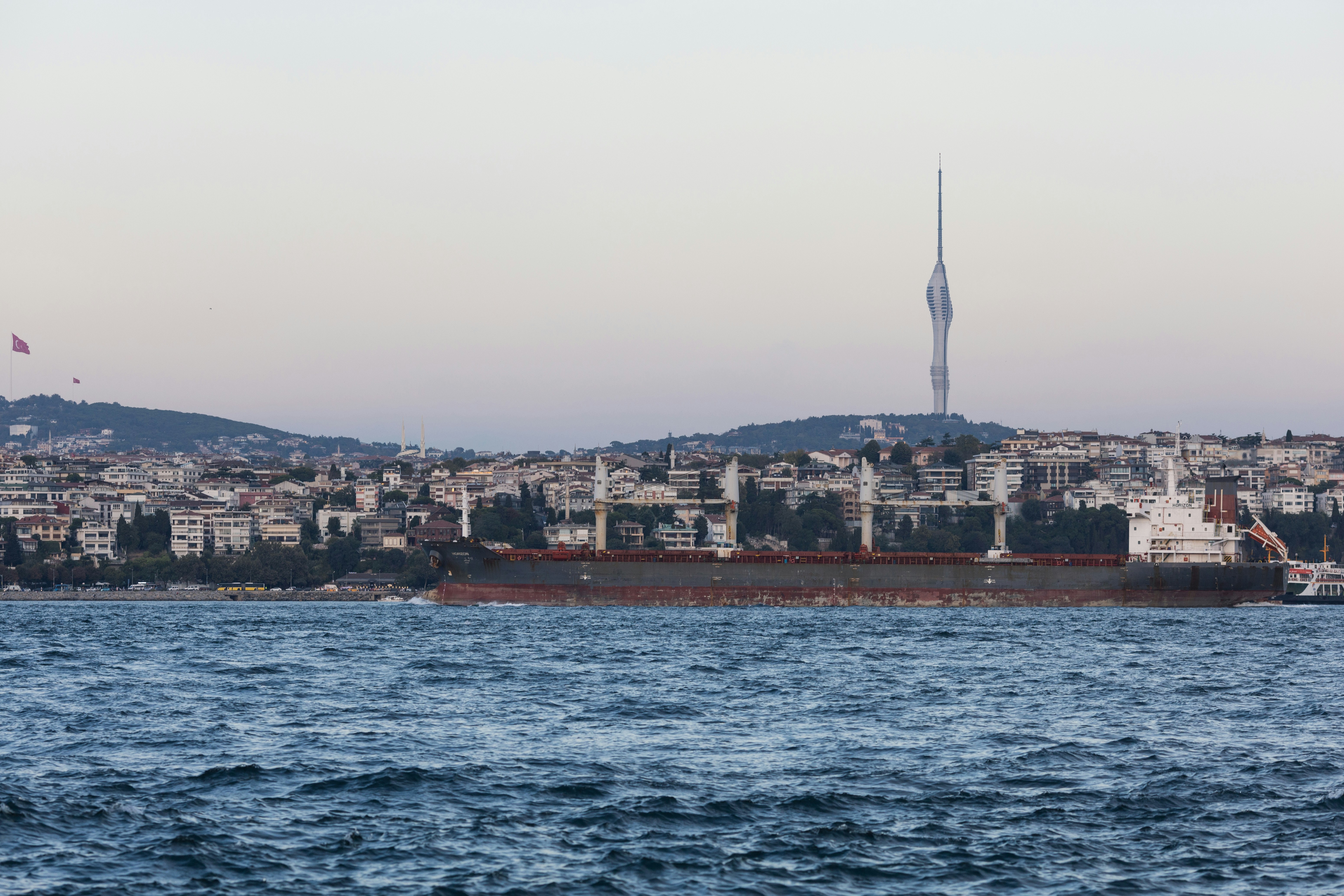 a large cargo ship in the middle of a body of water
