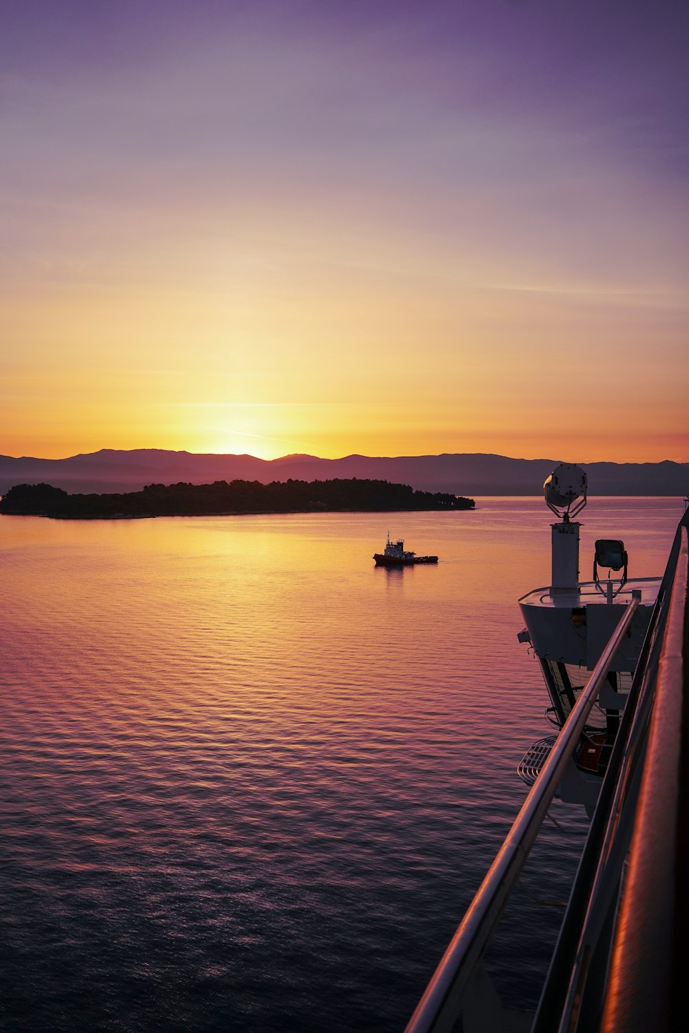 the sun is setting over a body of water