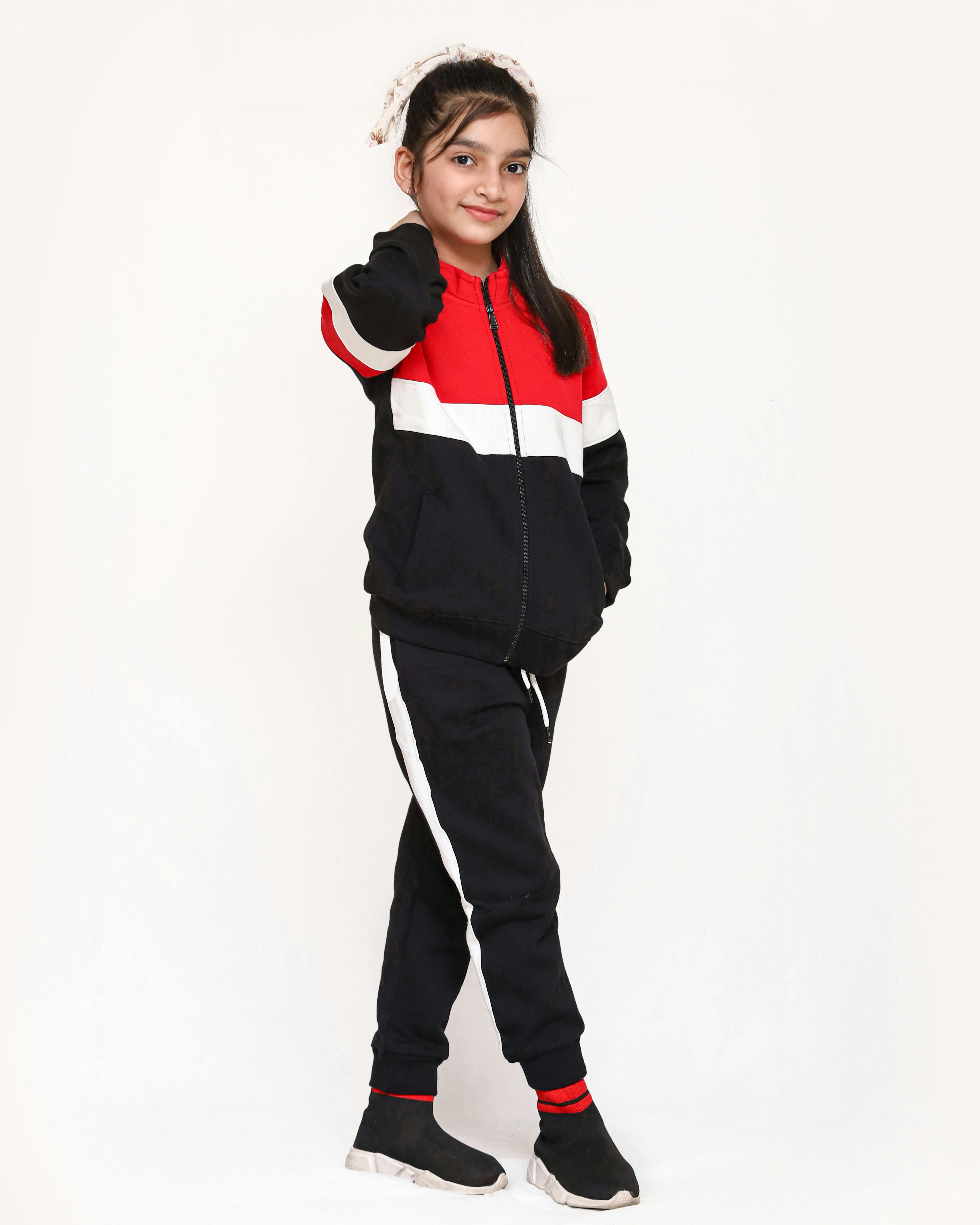 Colorful kids tracksuit set flat lay white background bright clean environment