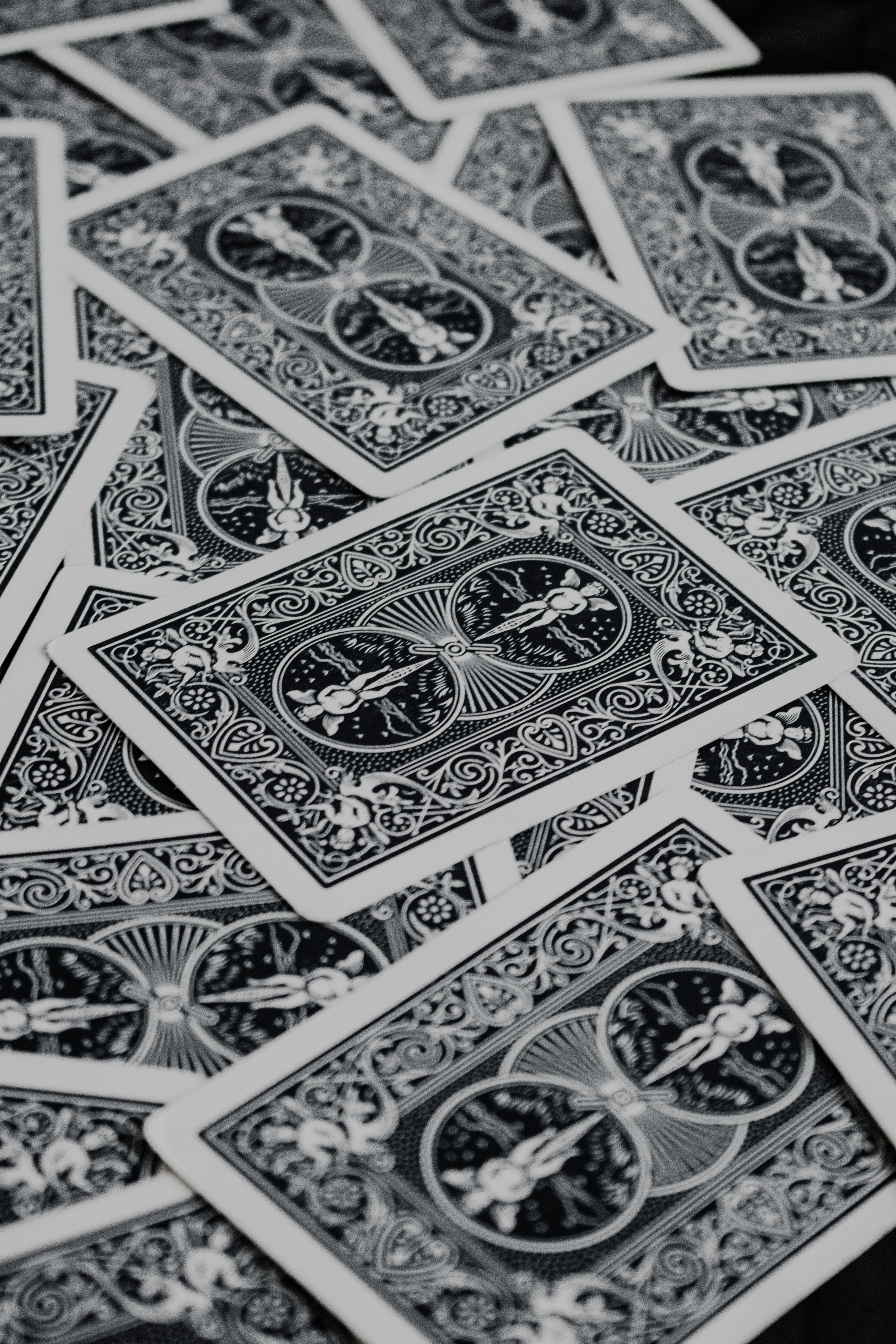 a pile of playing cards sitting on top of a table