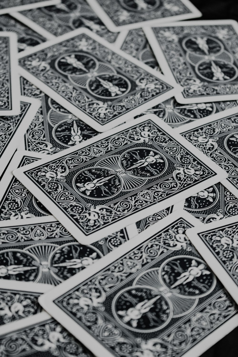 a pile of playing cards sitting on top of a table