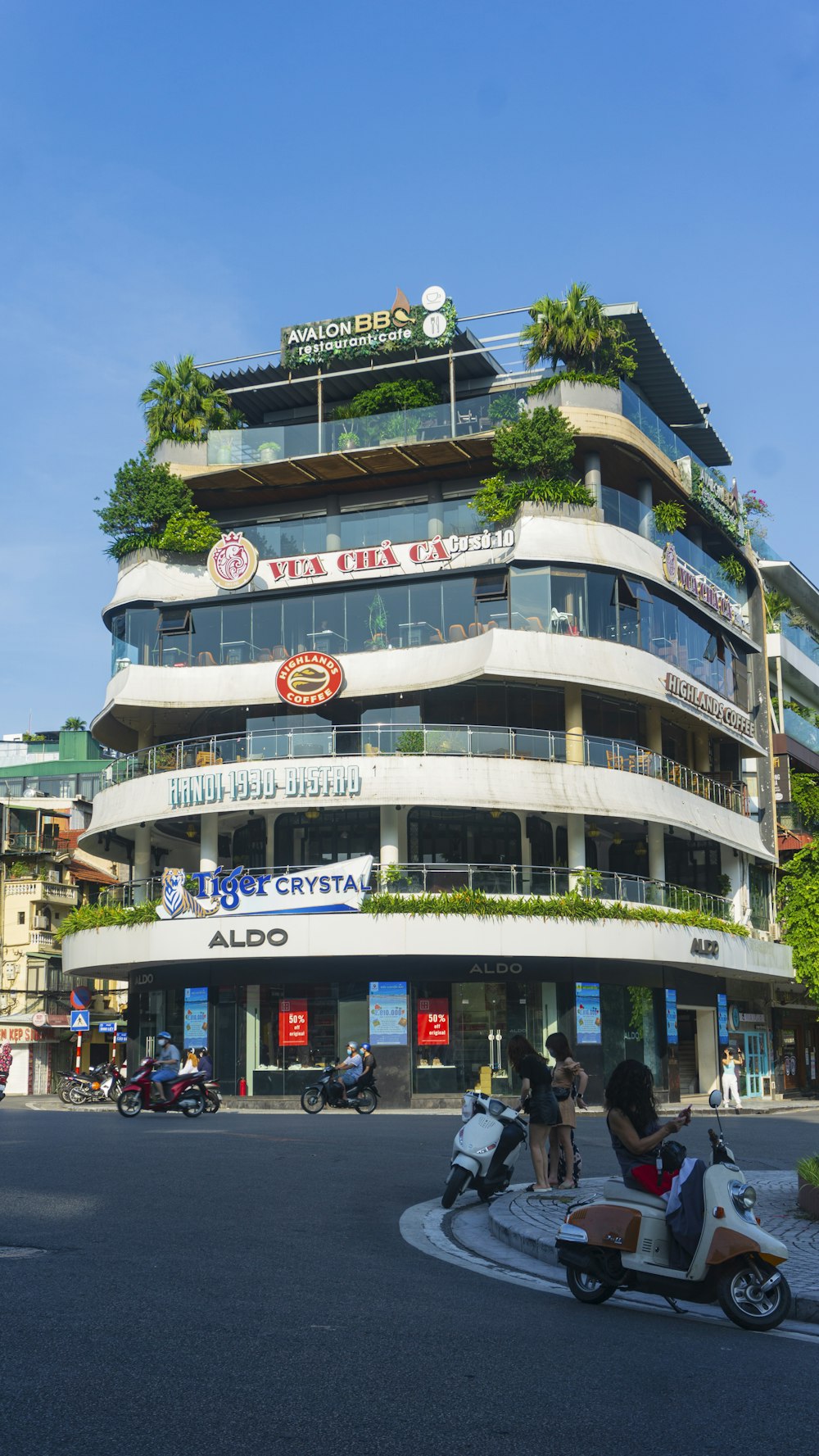 a motorcycle parked in front of a tall building