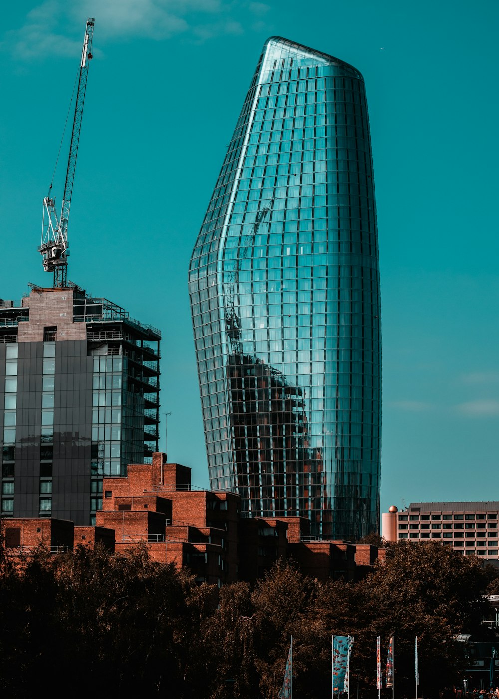 a very tall building with a crane on top of it