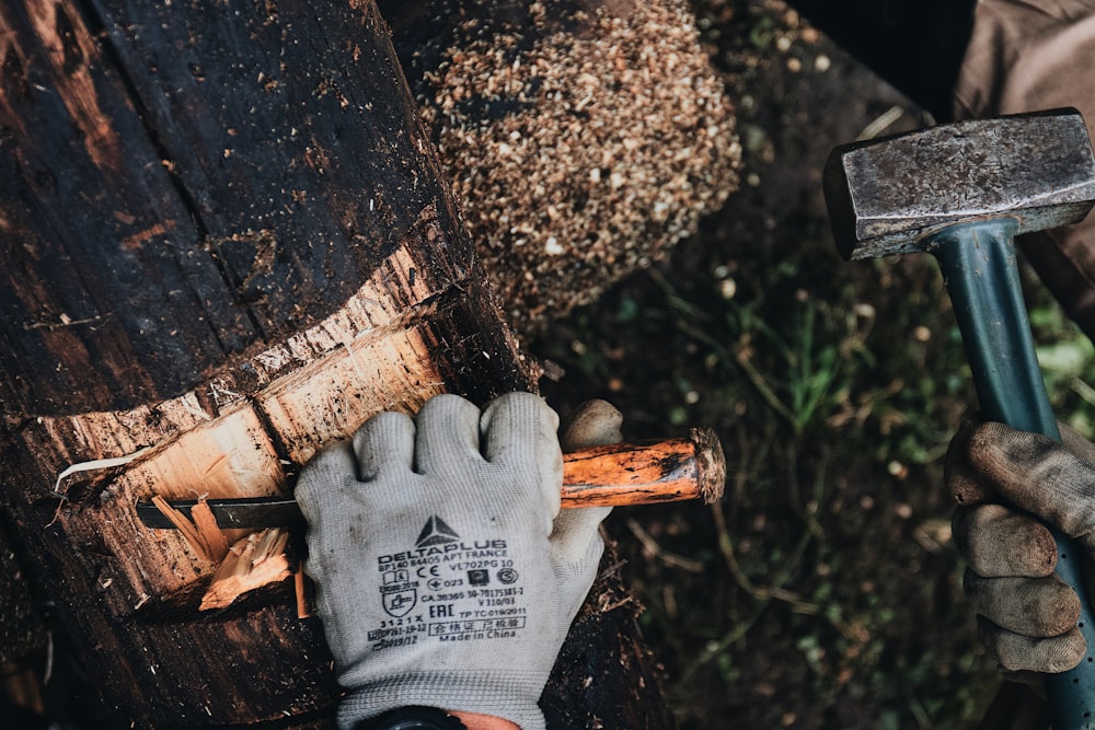 a man holding a hammer in his right hand