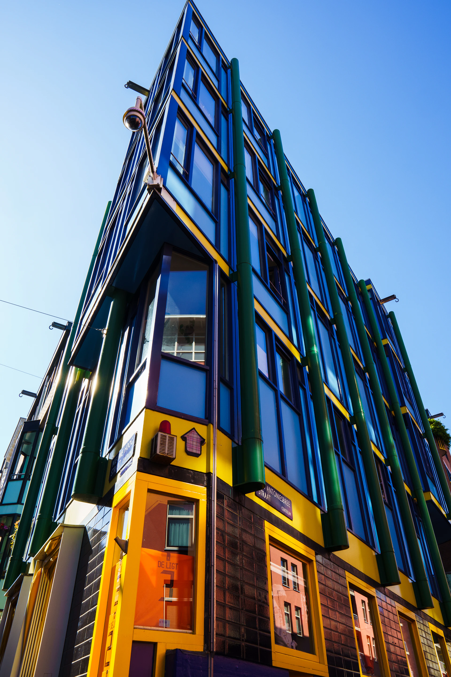 A dynamic video still showing a sleek modern real estate property with vibrant yellow accents, capturing the essence of professional filmmaking for real estate.