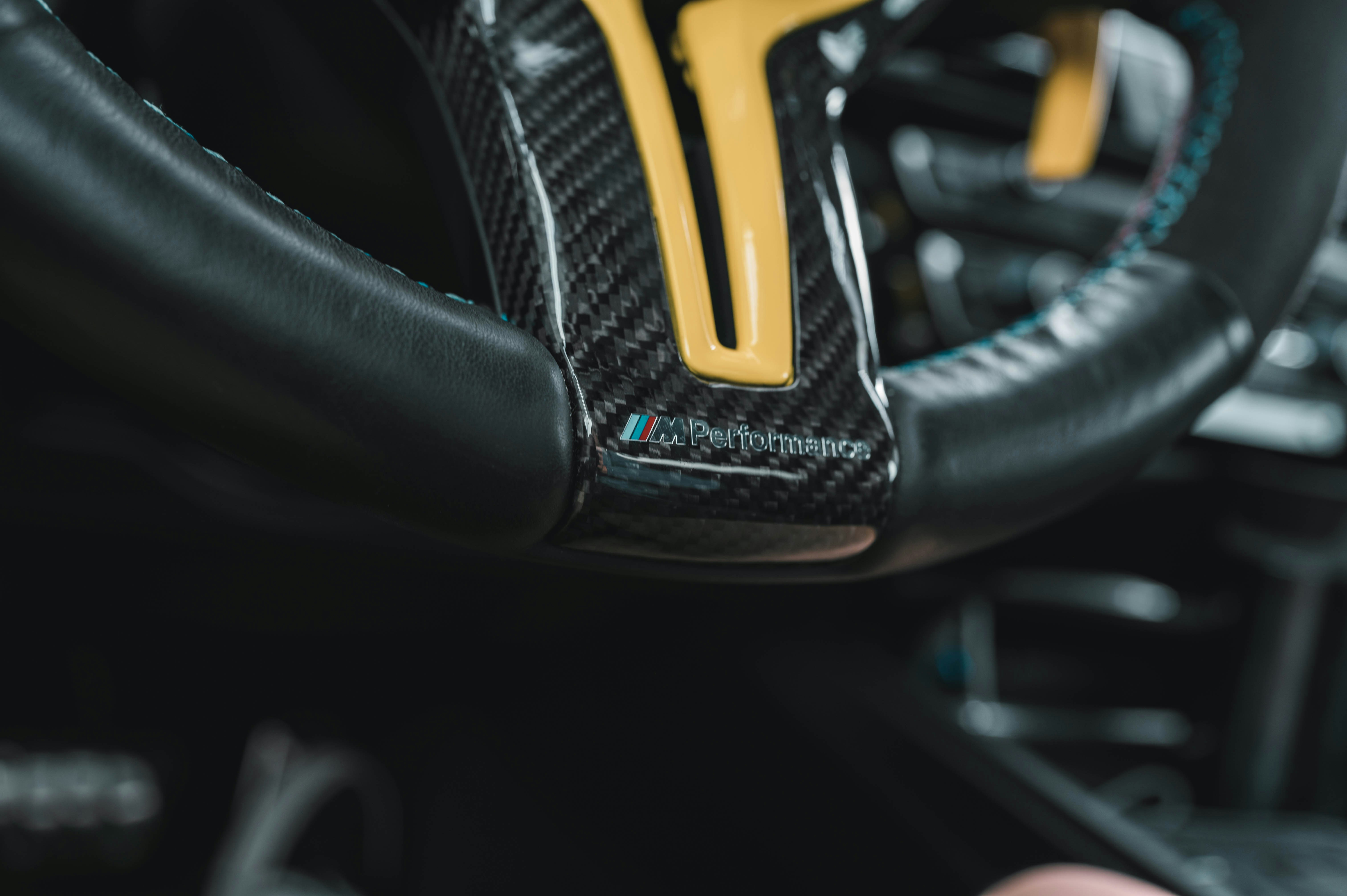 a close up of a steering wheel in a car