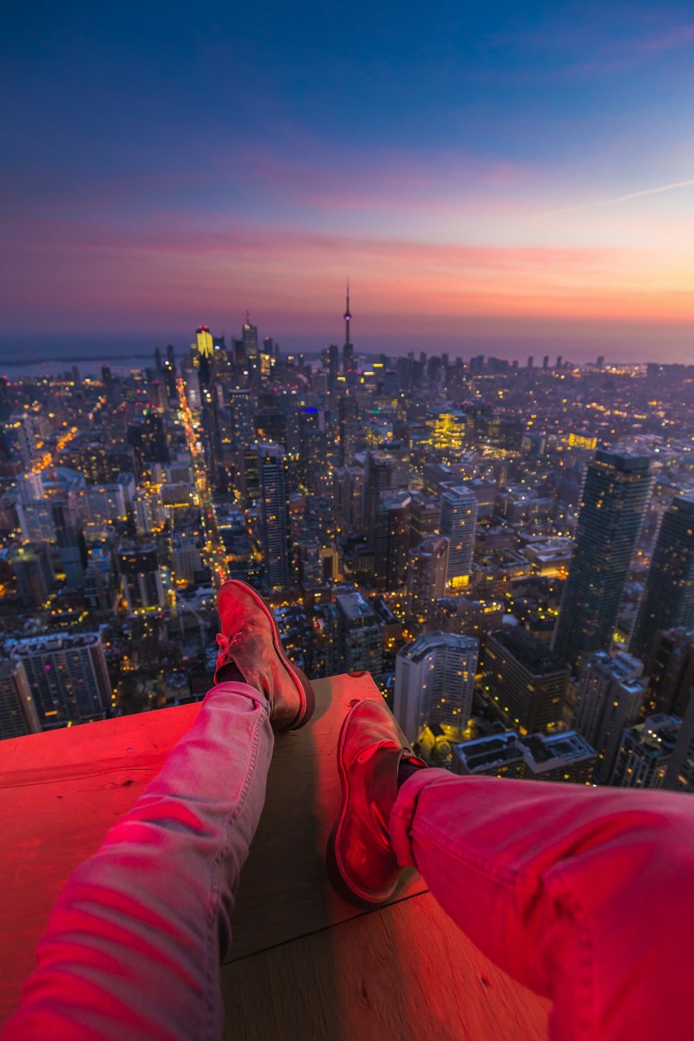 a person standing on top of a tall building