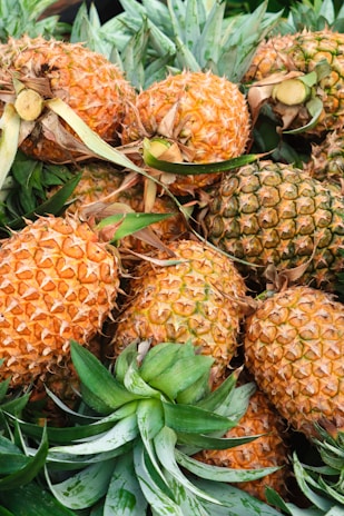 a pile of pineapples sitting next to each other