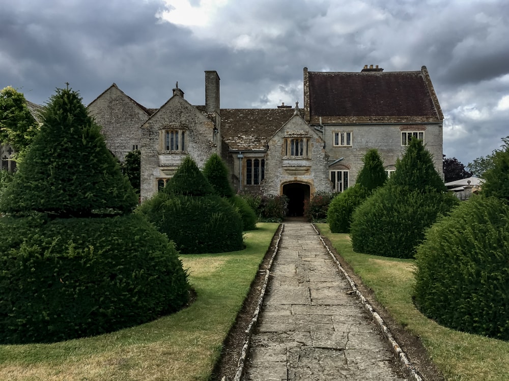 a large house with a stone pathway leading to it