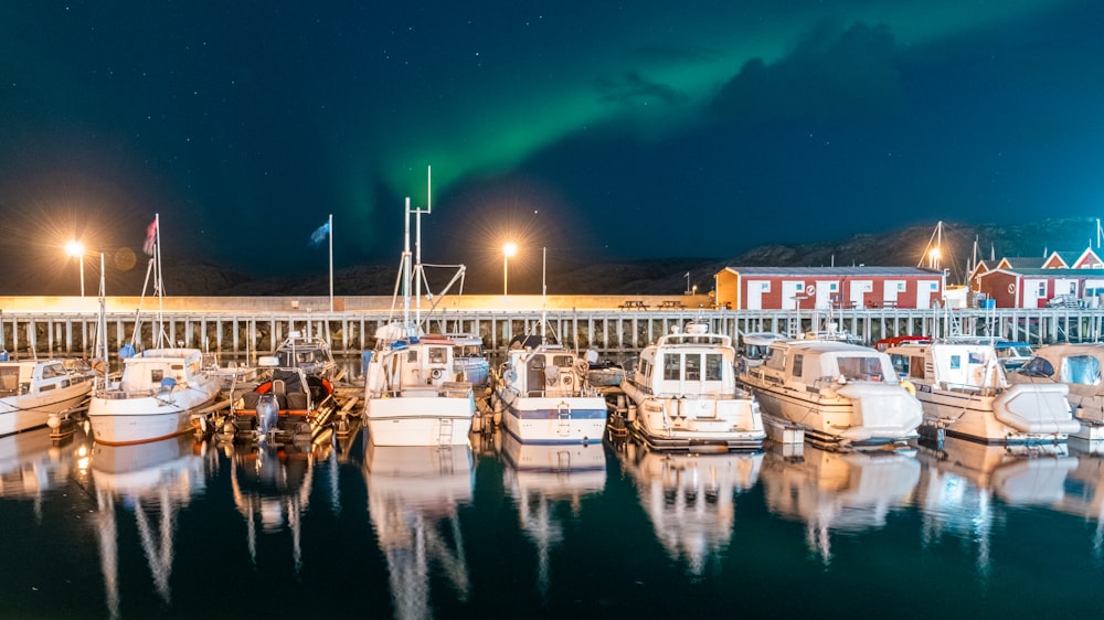 a group of boats are docked in a harbor