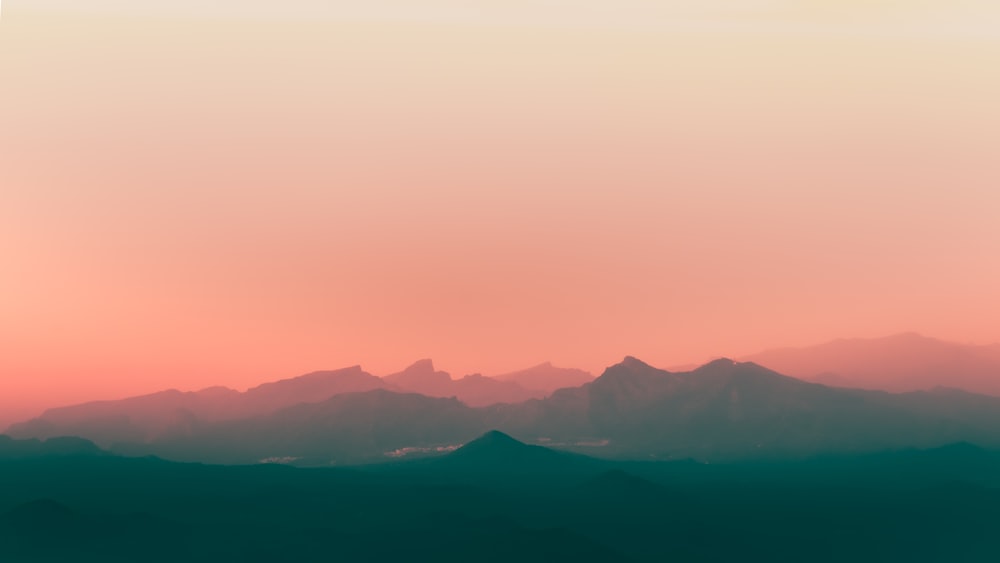 a view of a mountain range at sunset