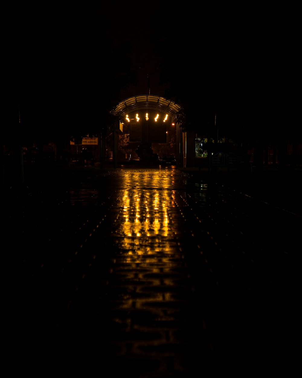 a stage lit up at night in the rain