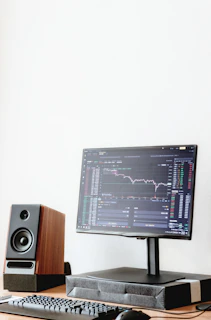 a computer monitor sitting on top of a wooden desk