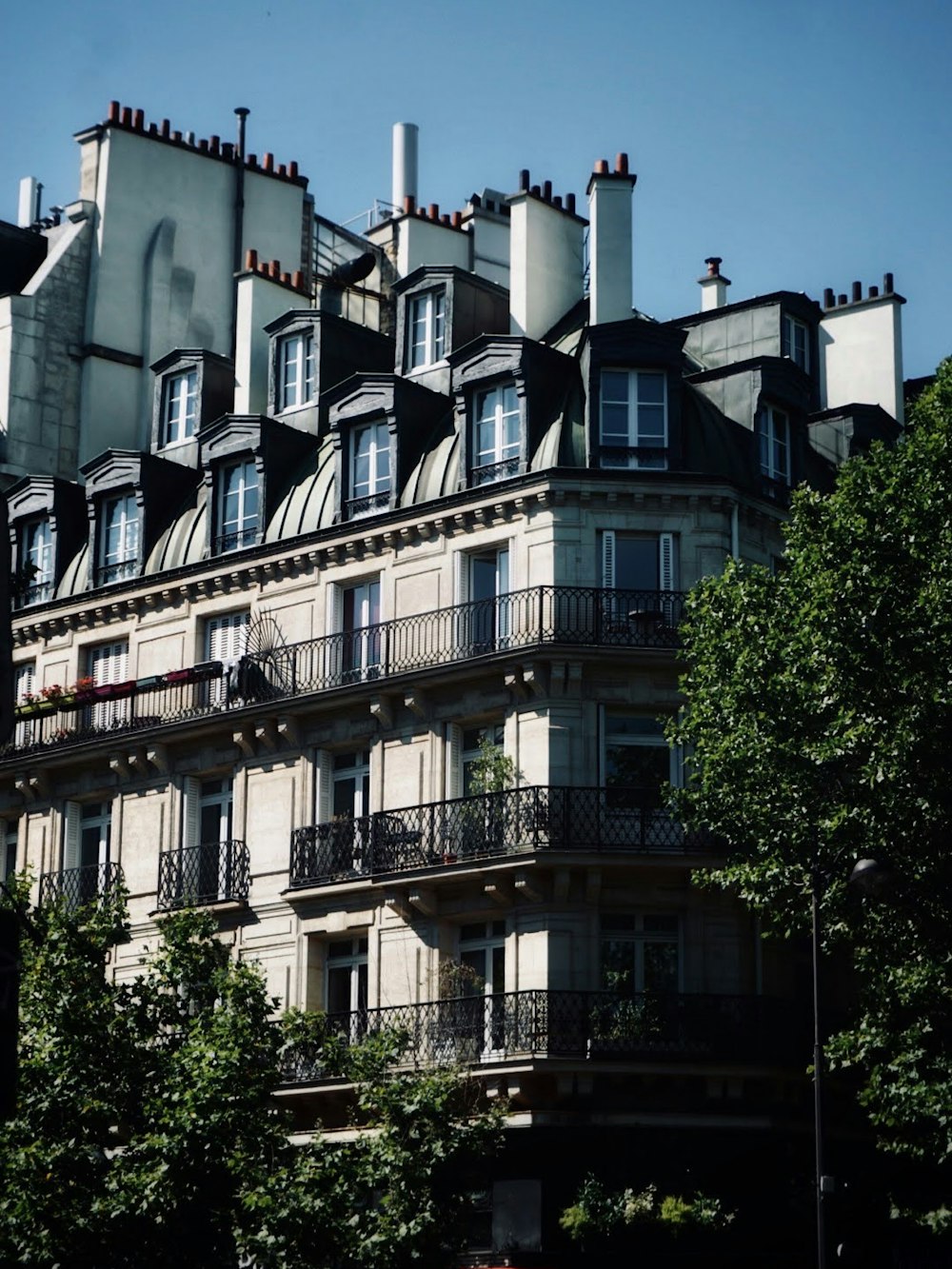 a tall building with balconies and balconies on the top of it