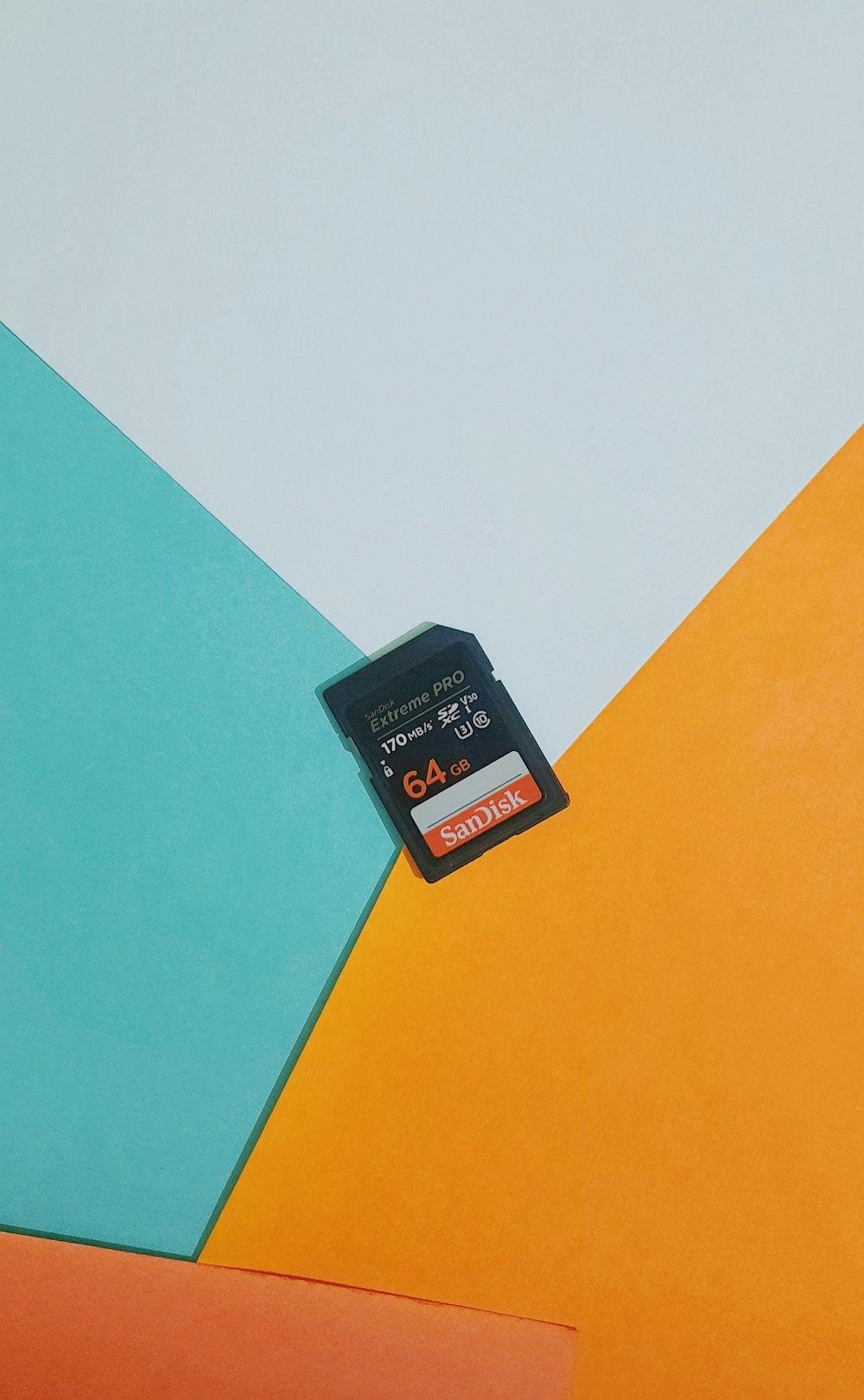a sim card sitting on top of a colorful wall