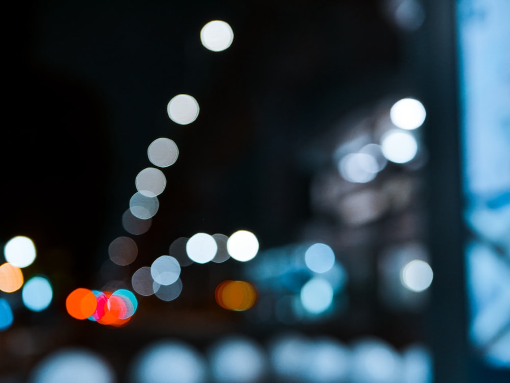 a blurry photo of a city street at night