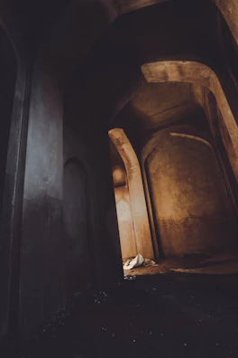 Historic home hallway with preserved plaster walls showing subtle variations in texture and color.