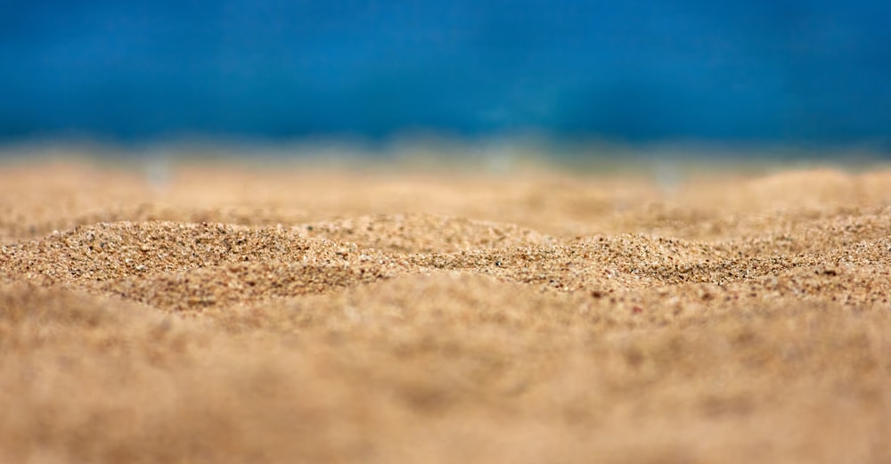 a blurry photo of sand on a beach
