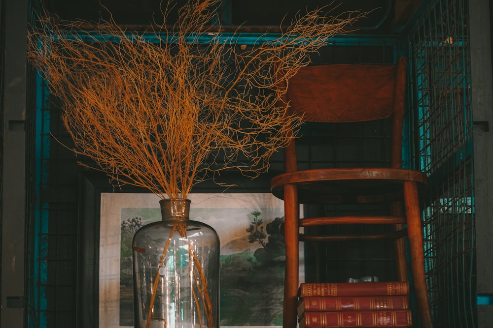 a vase filled with branches sitting on top of a table