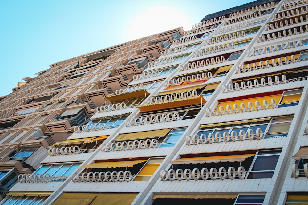 a very tall building with many balconies on it