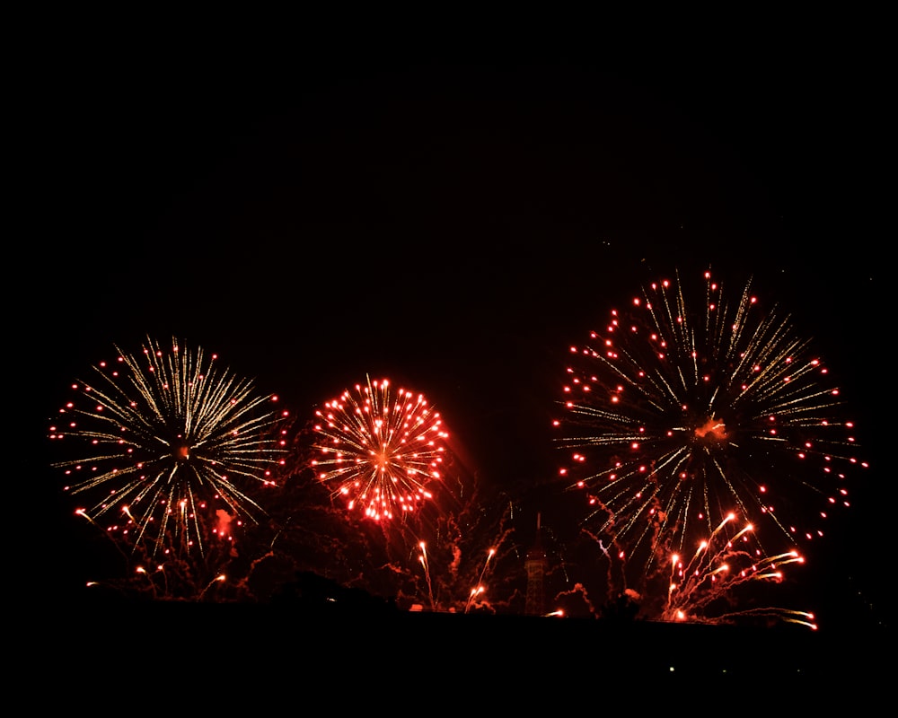 fireworks are lit up in the night sky