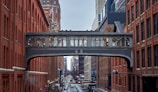 a bridge over a street in a city