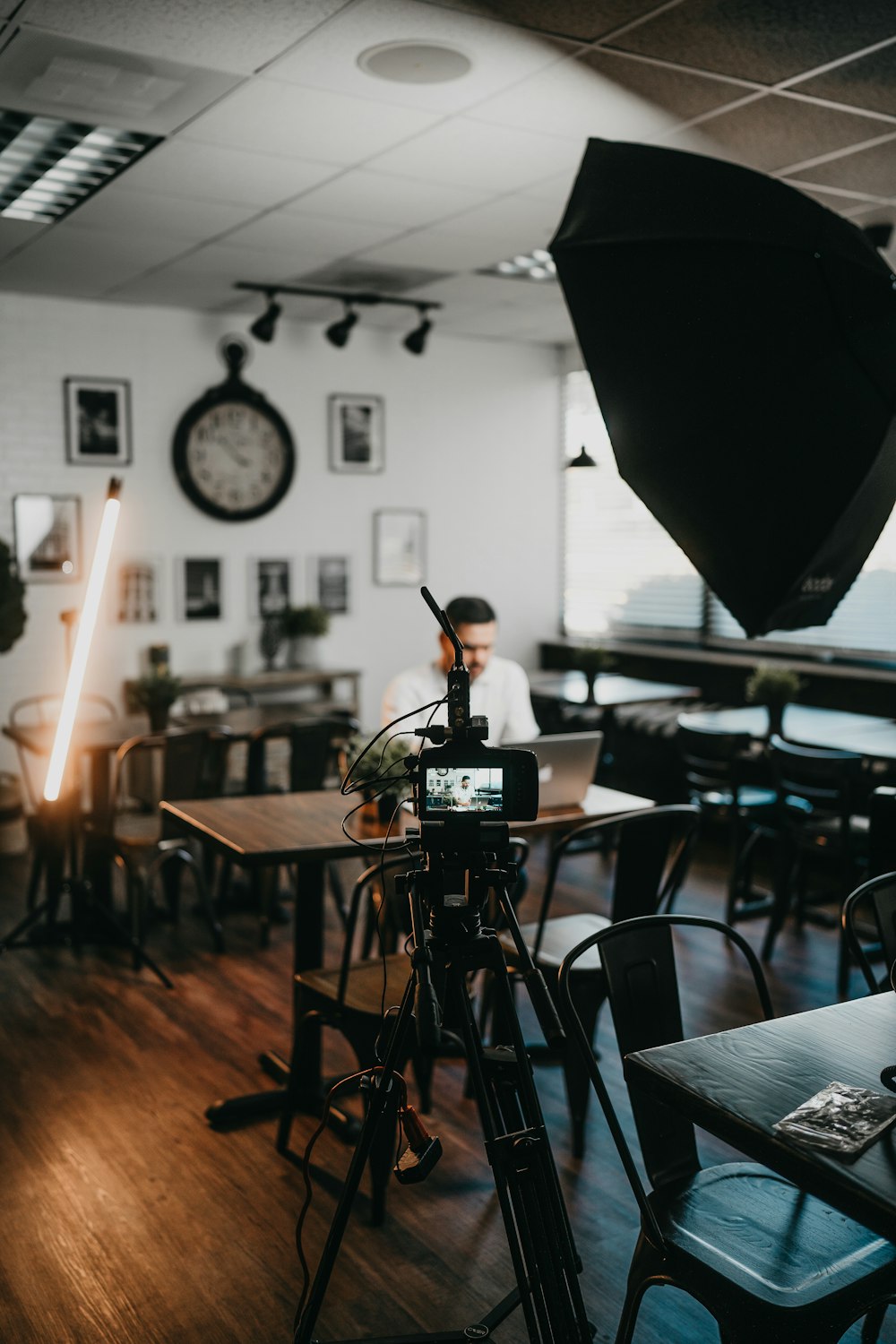 a camera set up in front of a table in a restaurant