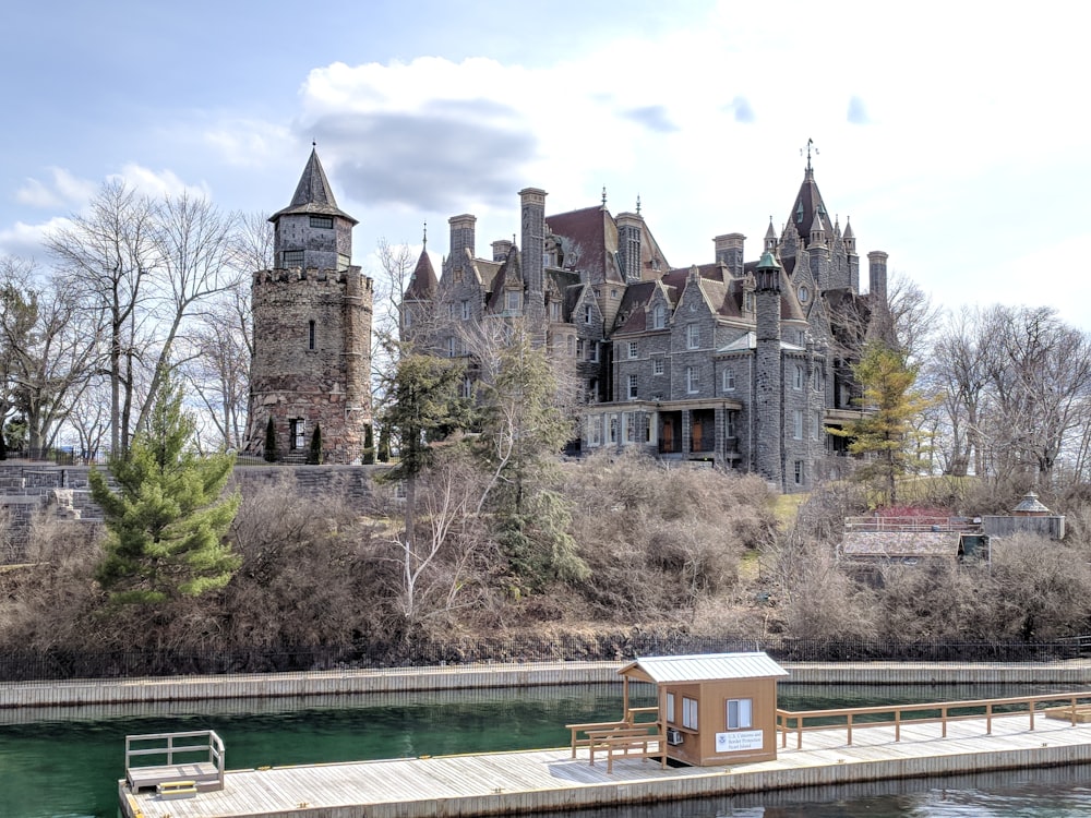 a large castle like building next to a body of water