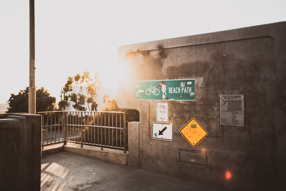 a street sign on the side of a bridge