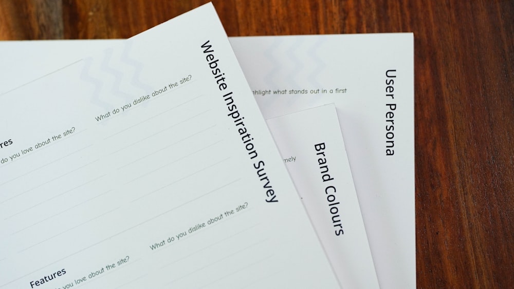 a close up of a stack of papers on a table