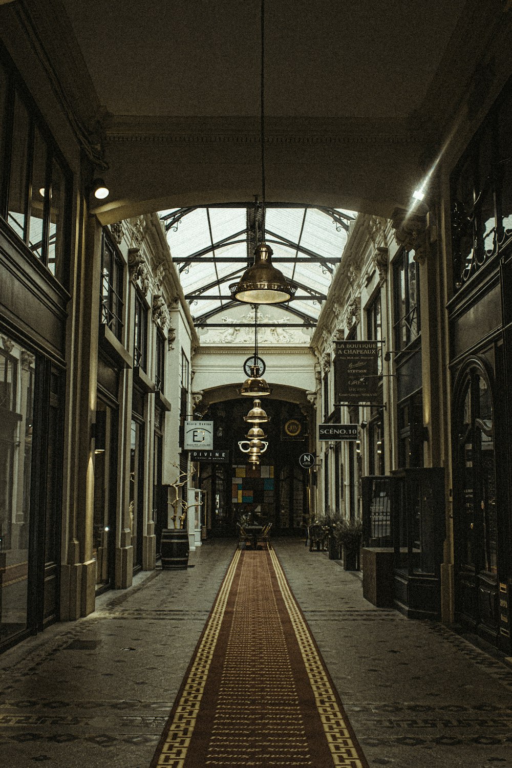 a long hallway with a light hanging from the ceiling