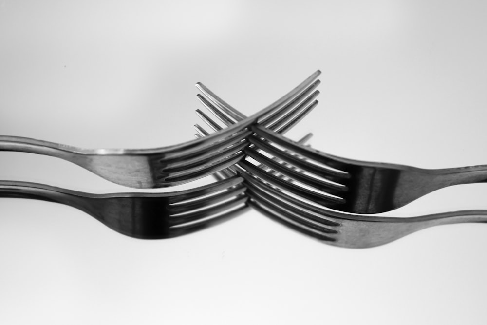 a stack of forks sitting on top of each other