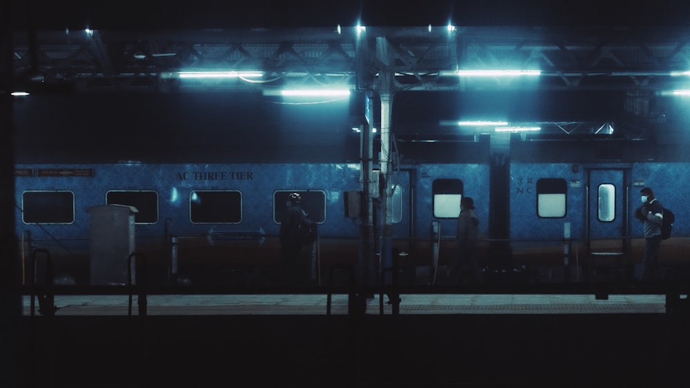 a train parked at a train station at night