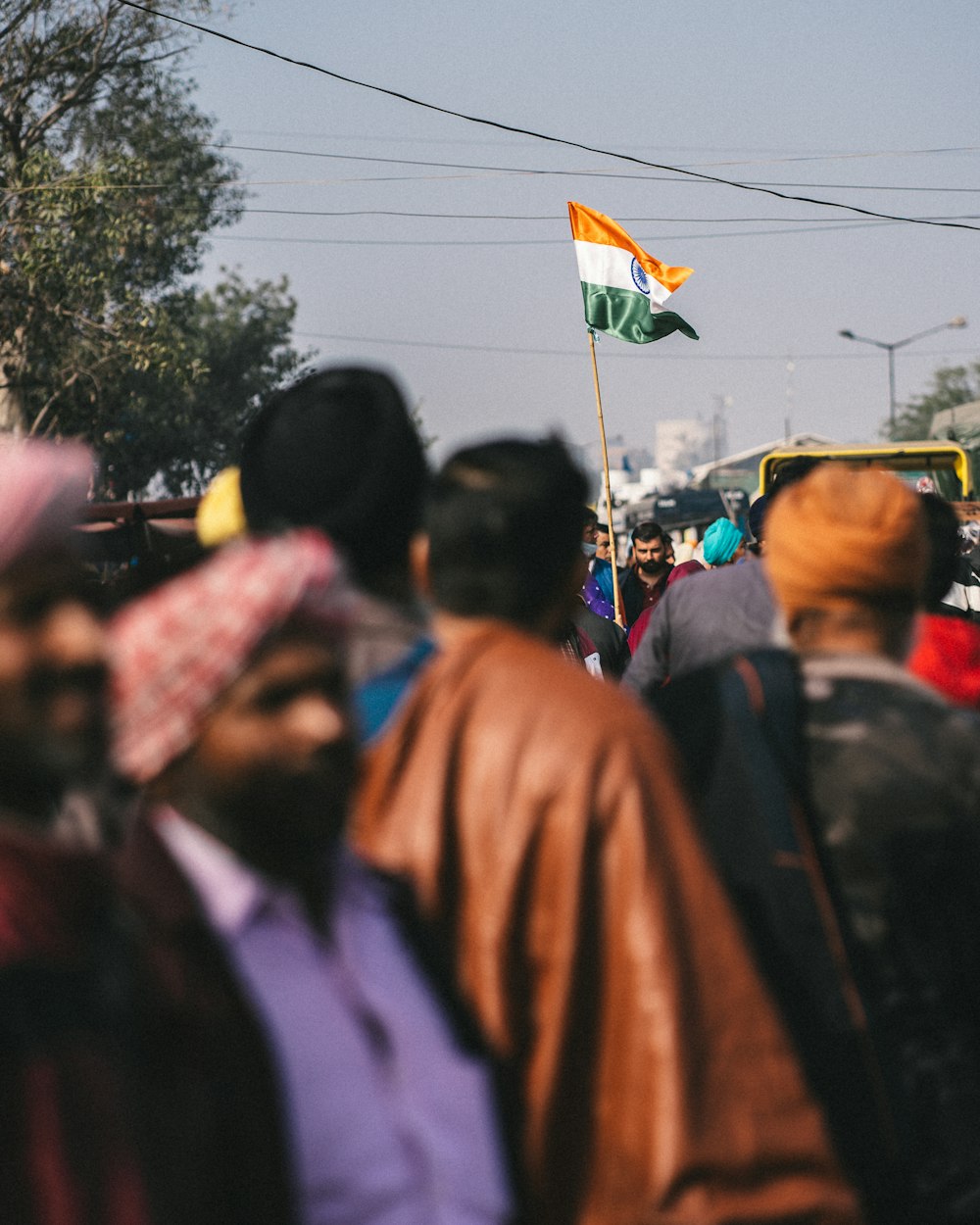 a crowd of people walking down a street