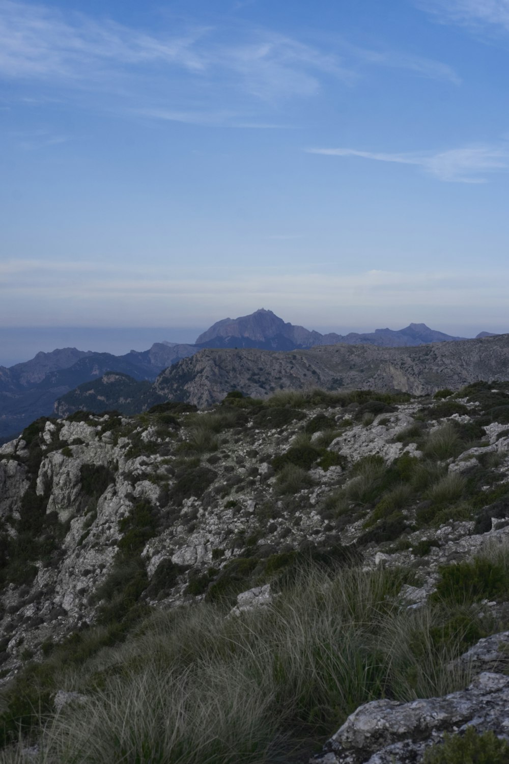 a man standing on top of a rocky hillside