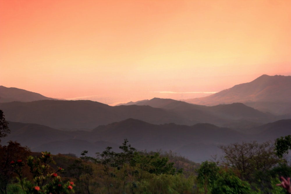 a view of a mountain range at sunset