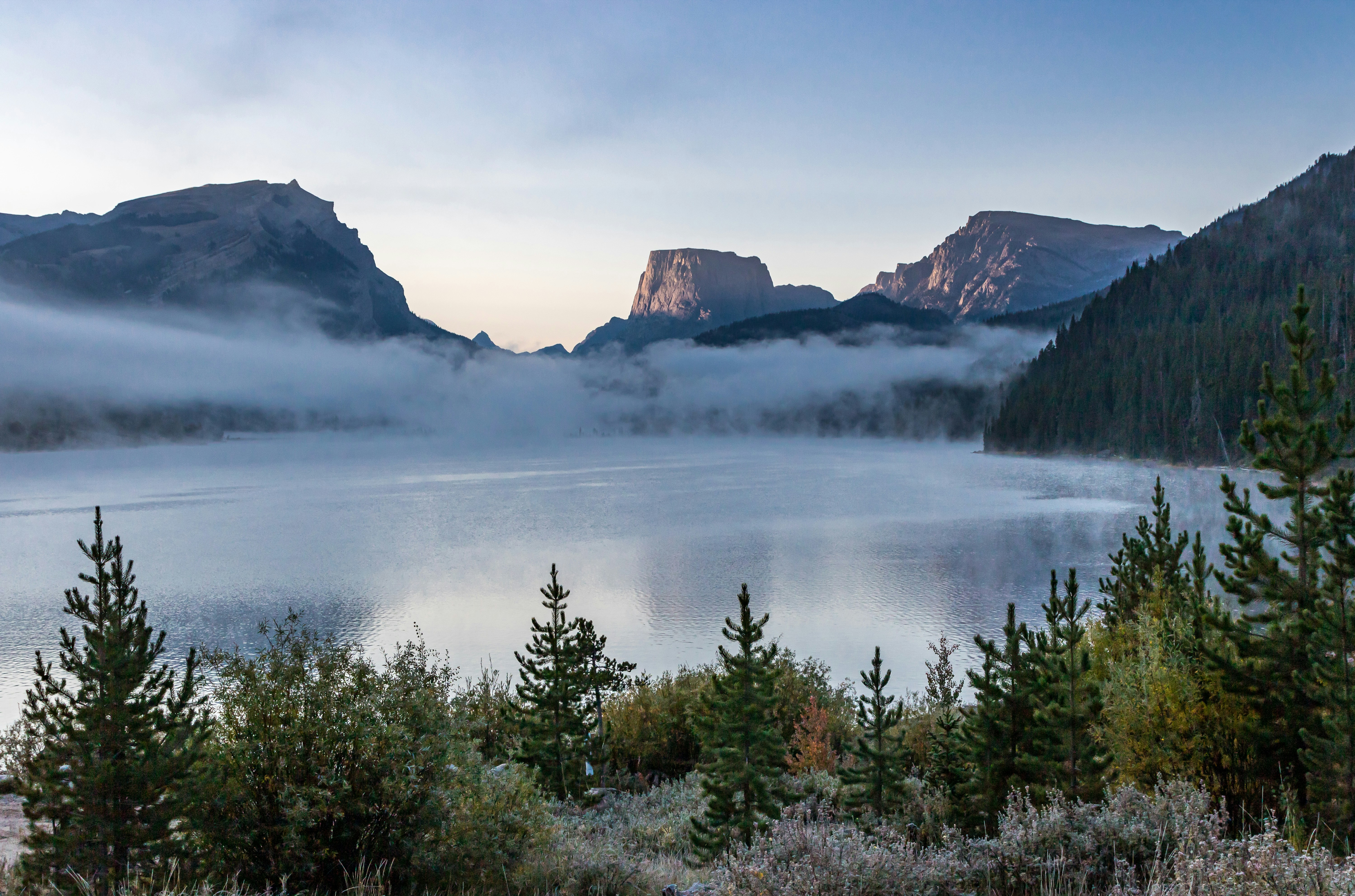 Early morning fog/cloud laying over Green River Lake with Squaretop Mtn in the background at sunrise.