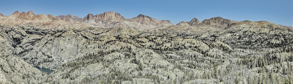 a view of a mountain range with a lake in the middle