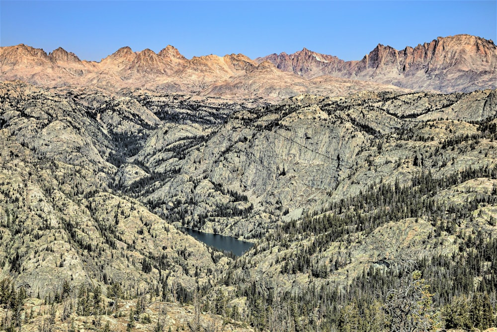 a view of a mountain range with a lake in the middle