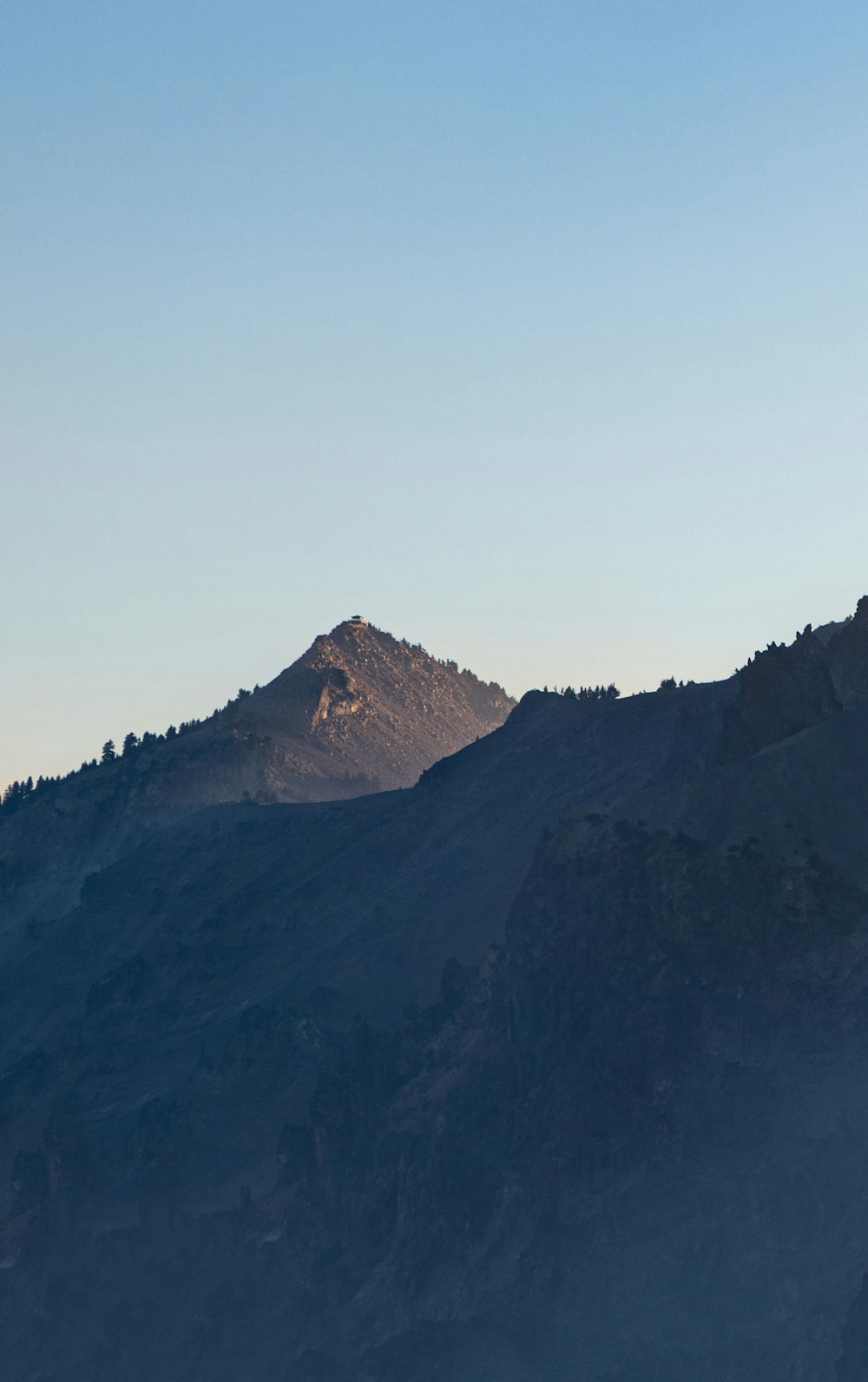 a view of a mountain from the top of a hill