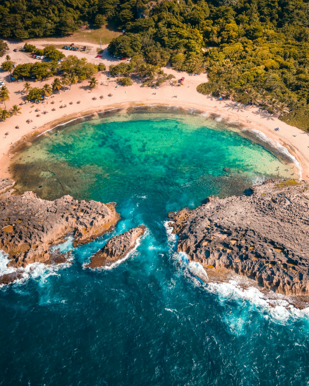 an aerial view of a sandy beach and ocean