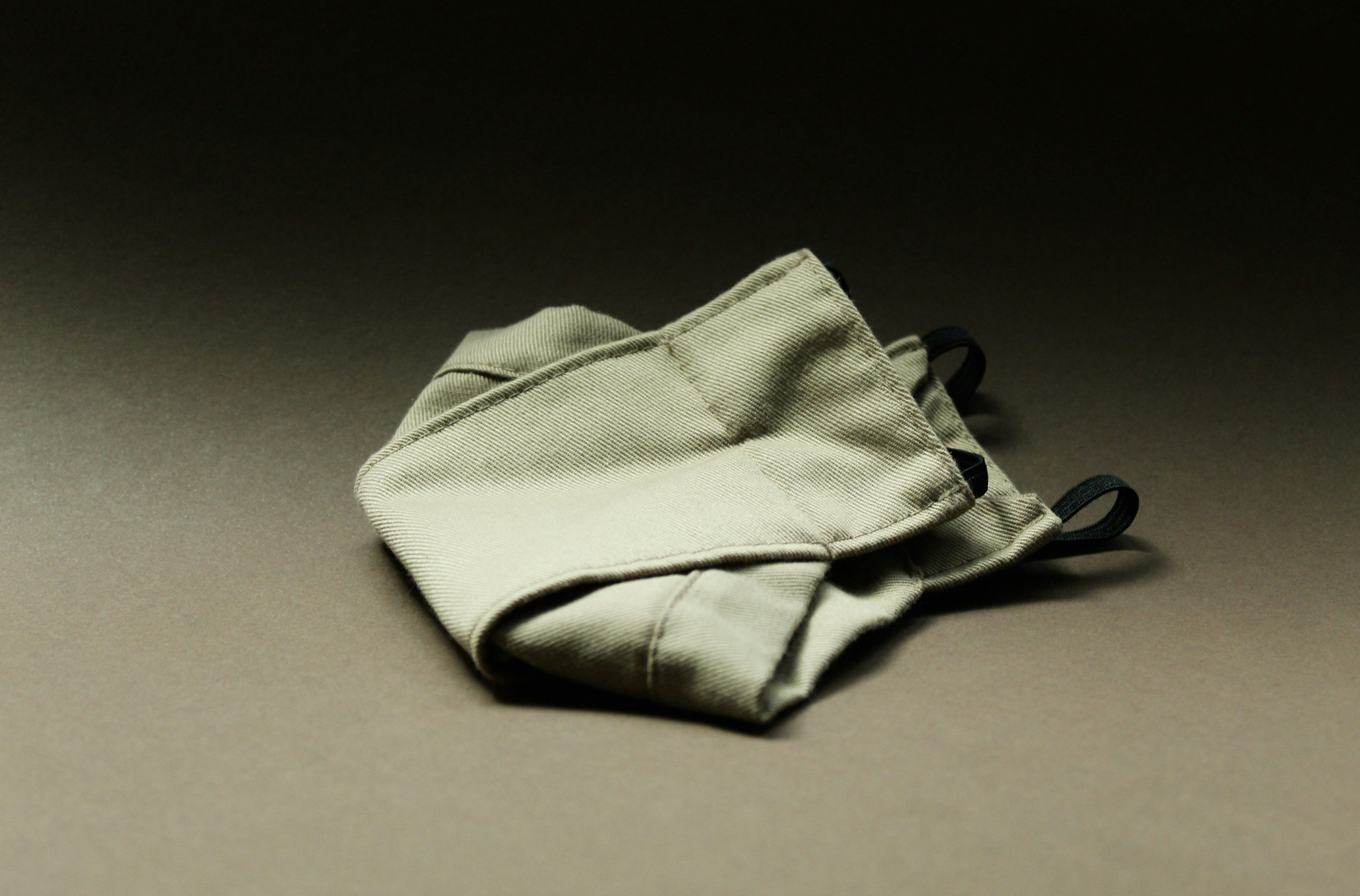 beige face mask with blurred background
