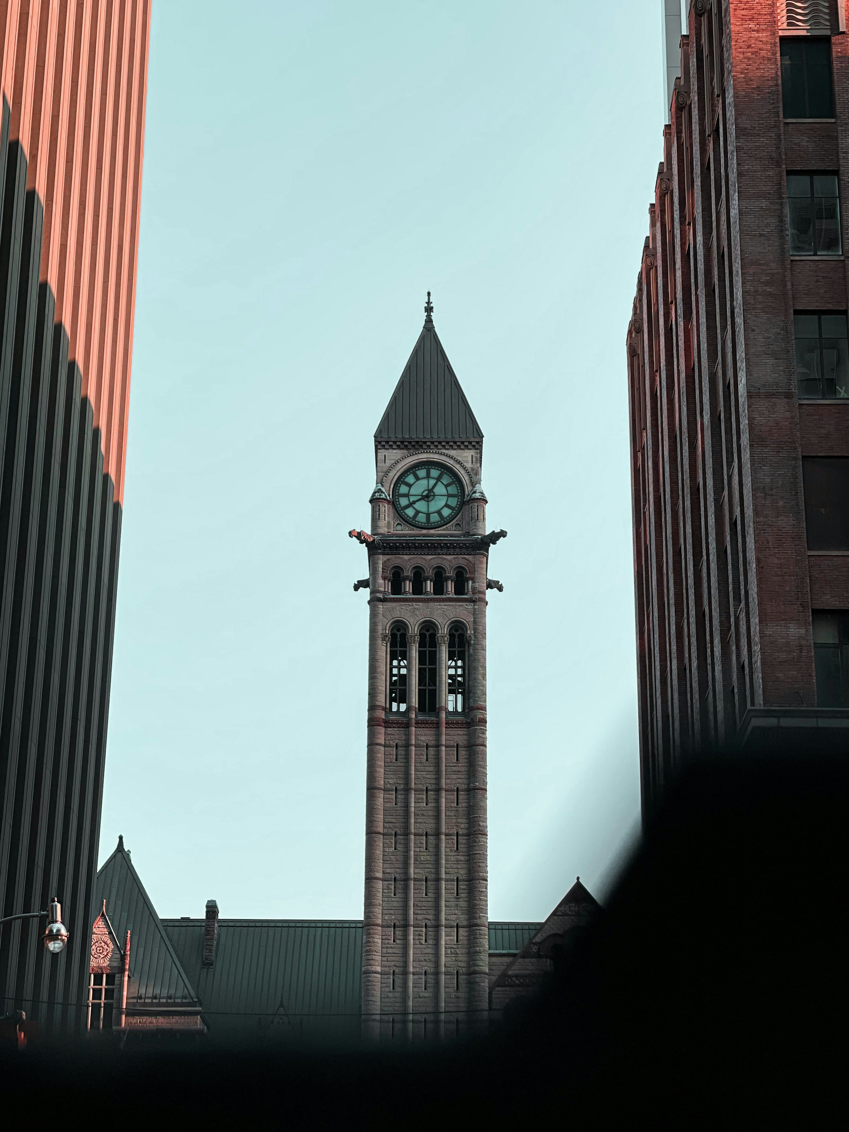 a tall clock tower towering over a city