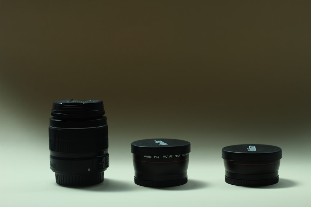 a camera lens sitting next to another camera lens