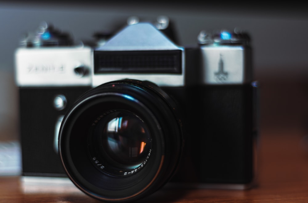 a camera sitting on top of a wooden table